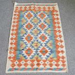 A kelim rug, with two rows of medallions and geometric design, 123 x 80cm