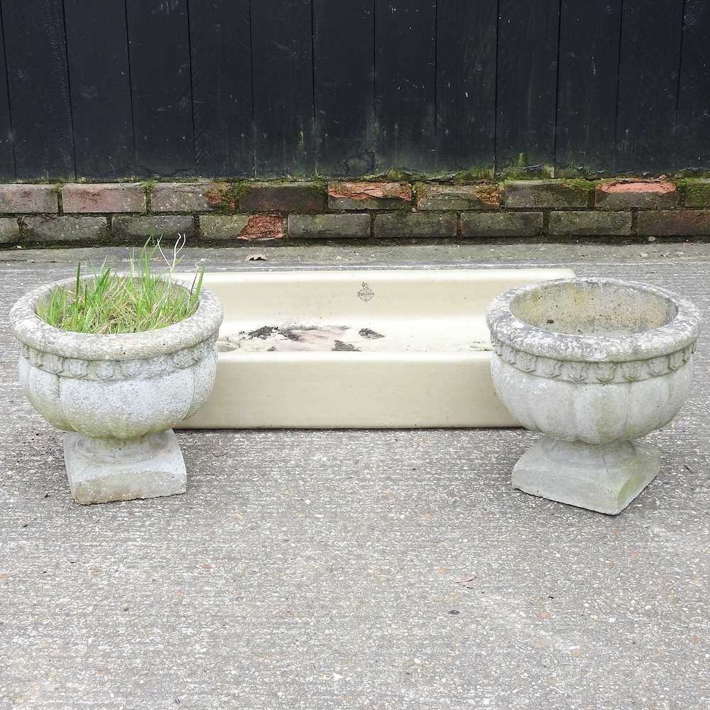 A Royal Doulton stoneware sink, 91cm wide, together with a pair of cast stone garden planters (3)