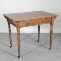 A late 19th century oak writing table, with an inset top, by Waring & Gillows 92w x 58d x 74h cm