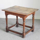 An 18th century oak side table, on turned legs 78w x 59d x 65h cm