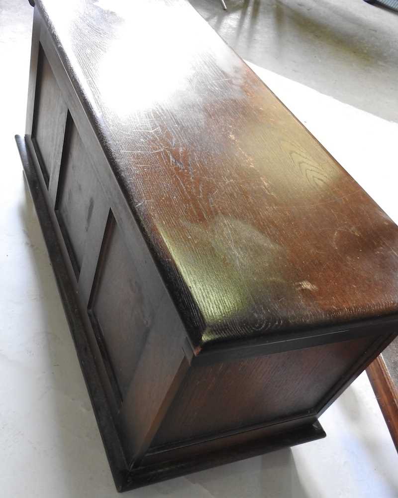 A 1920's oak coffer, with a hinged lid, 96cm wide, together with a 1920's tea trolley (2) 96w x - Image 2 of 4