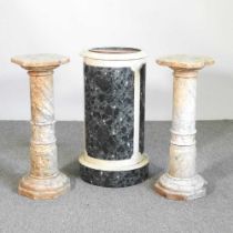 A pair of marble columns, 70cm high, together with a simulated marble cylinder washstand (3)