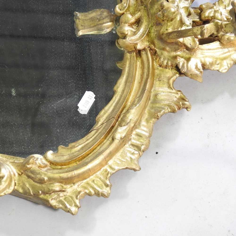 A Rococo style gilt framed girandole, 20th century, of cartouche shape, with a scrolled surround and - Image 2 of 5