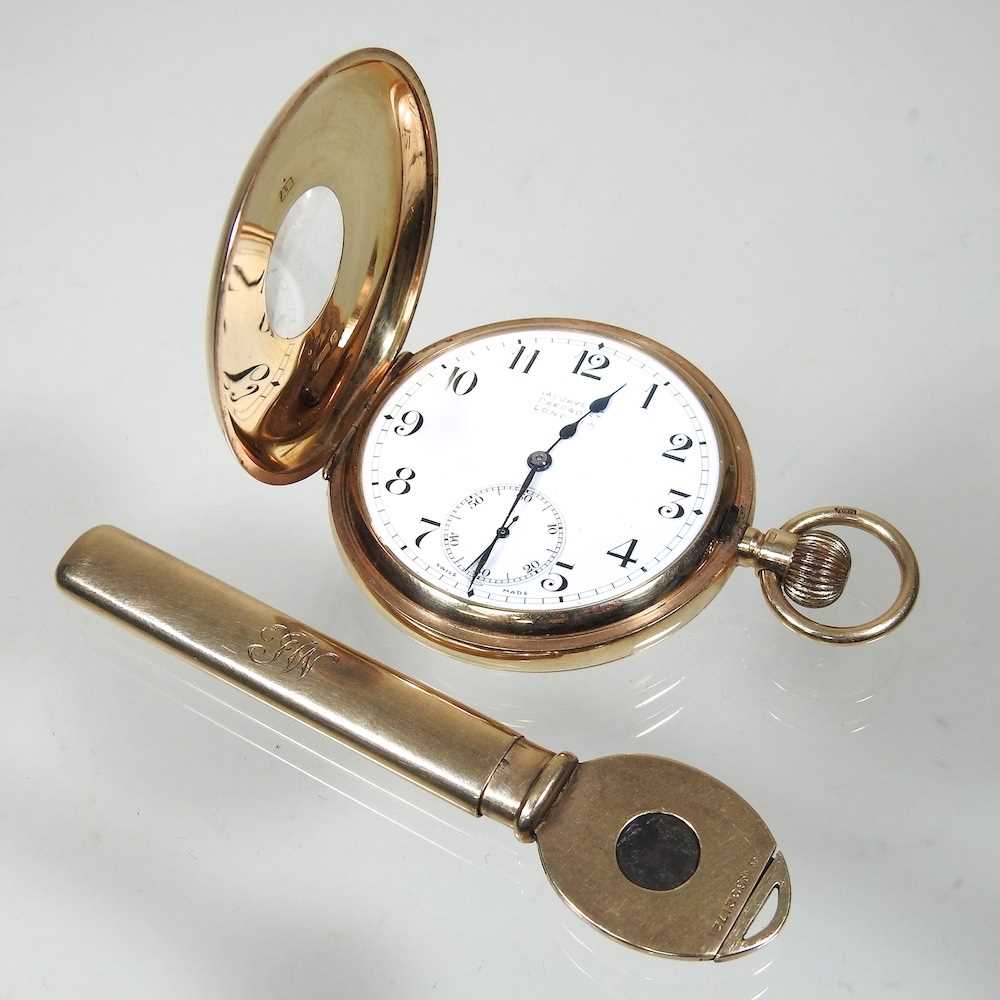 A 9 carat gold cased half hunter pocket watch, with a white enamel dial, signed Jays Oxford