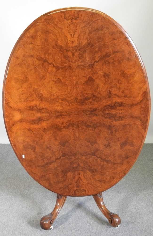 A Victorian burr walnut breakfast table, with a hinged oval top, on a quadruped base 136w x 102d x - Image 2 of 4