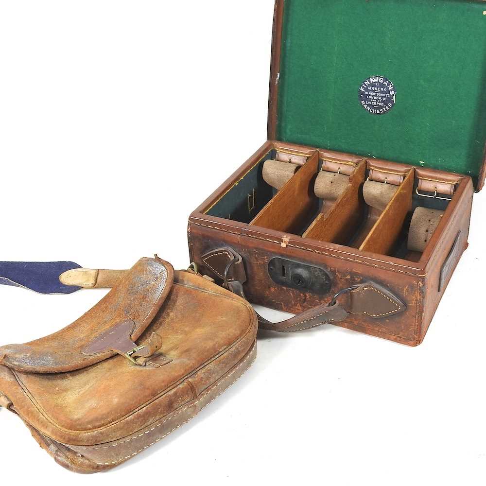 A 19th century leather cartridge case, by Finnigan Ltd, New Bond Street, 33cm wide, together with