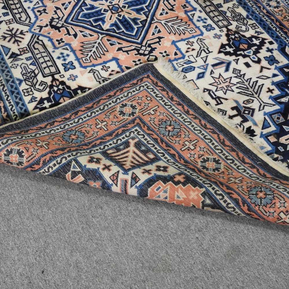 A Turkish woollen rug, with a central medallion, on a blue ground, 256 x 159cm - Image 5 of 6