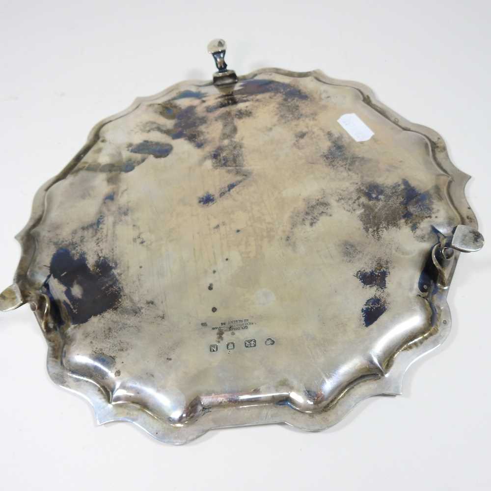 A mid 20th century silver salver, of circular shape, with a piecrust border, on hoof feet, with - Image 6 of 6