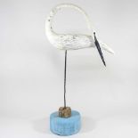 ARR Guy Taplin, b1939, Egret, painted driftwood sculpture, on a metal stand and wooden base,