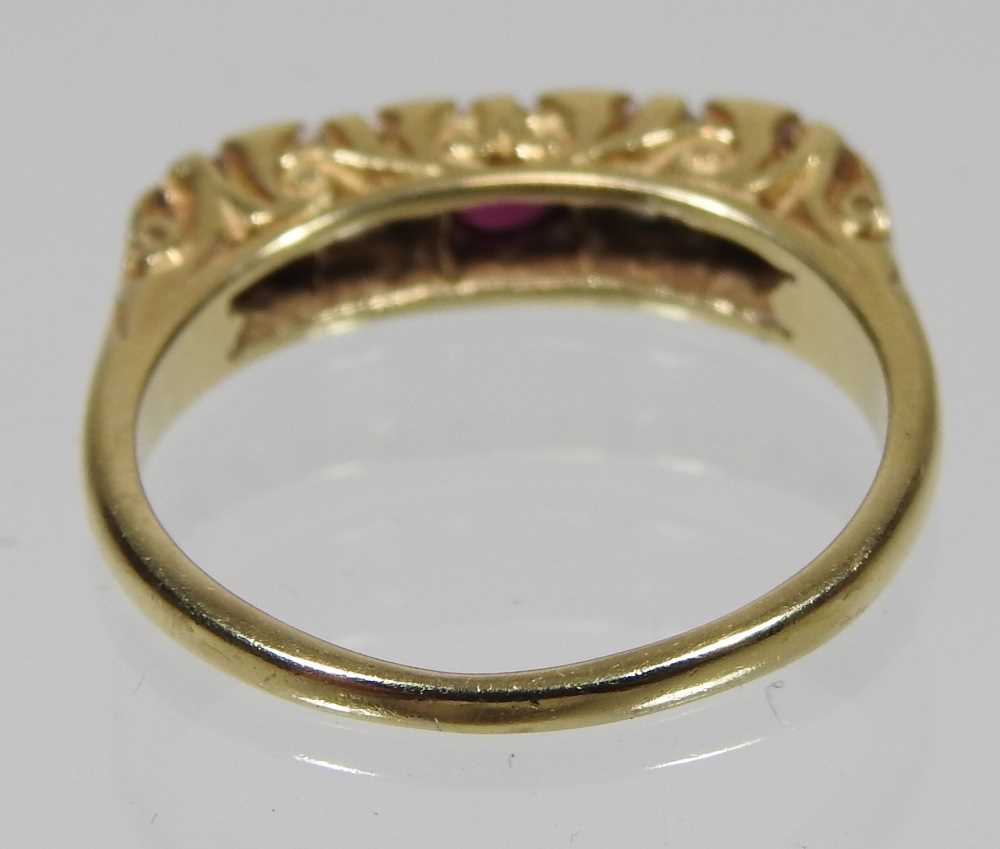 An 18 carat gold ruby and diamond ring, set with five alternating stones, 2.9g, size M, boxed - Image 4 of 7