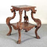 An early 20th century Italian carved walnut centre table, of Renaissance revival design, on four