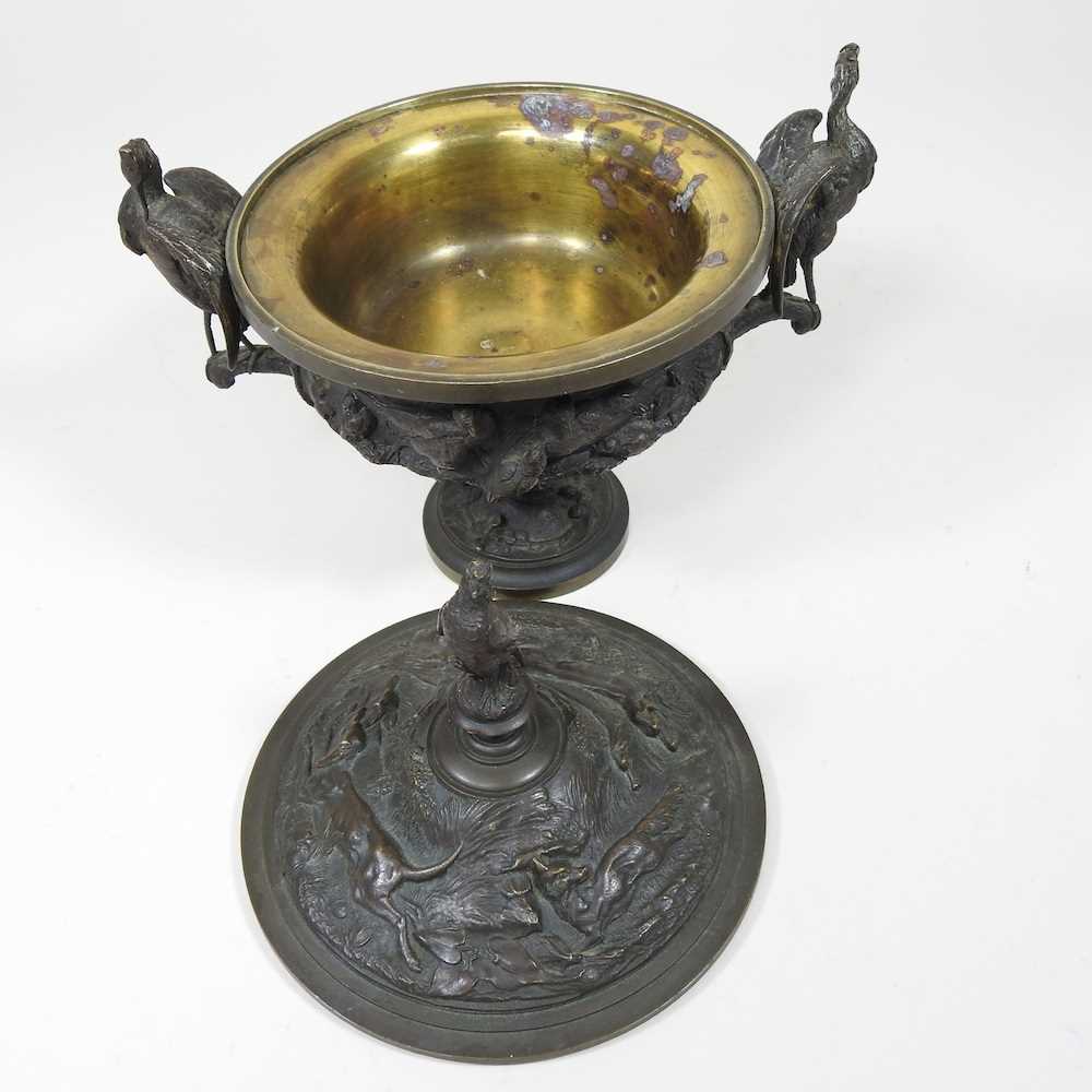 A 19th century cast bronze cup and cover, of pedestal form, decorated in relief with game, flanked - Image 3 of 12