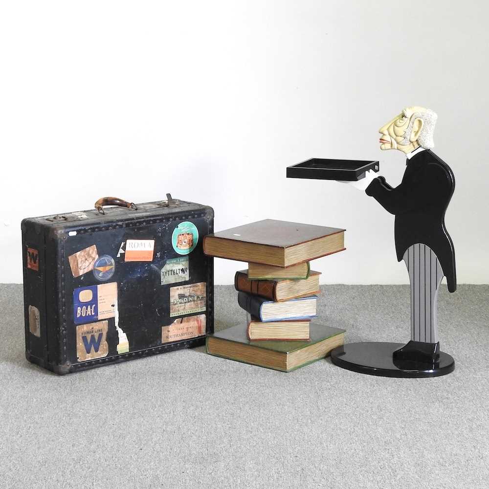 A waiter side table, 84cm high, together with a book side table and a 1950's suitcase (3)