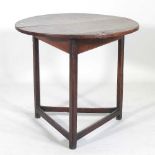 A 19th century and later oak cricket table, with a circular top, on a splayed base 74d x 68h cm