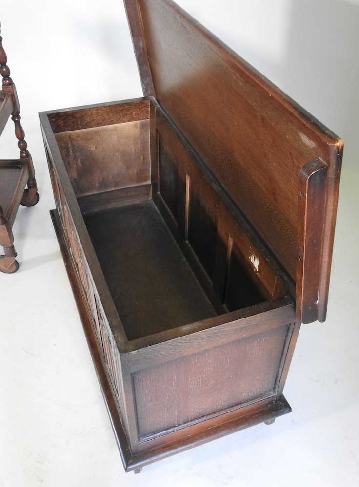 A 1920's oak coffer, with a hinged lid, 96cm wide, together with a 1920's tea trolley (2) 96w x - Image 4 of 4