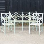 A Regency style cast iron garden set, with a strapwork back, comprising a bench and a pair of