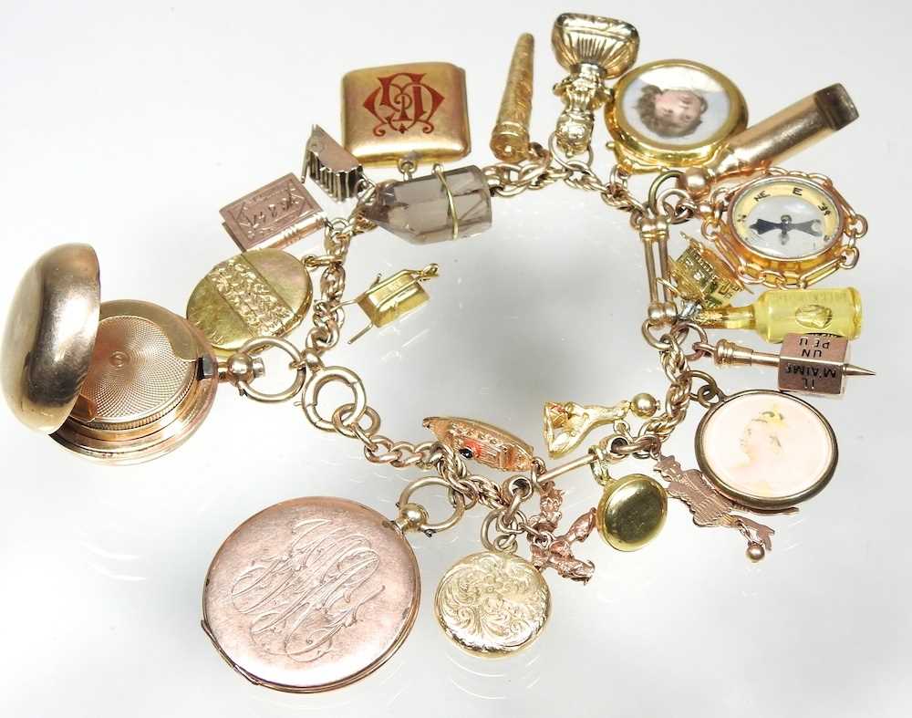 A gold charm bracelet, suspended with twenty-three various novelty charms, to include a sovereign - Image 3 of 12