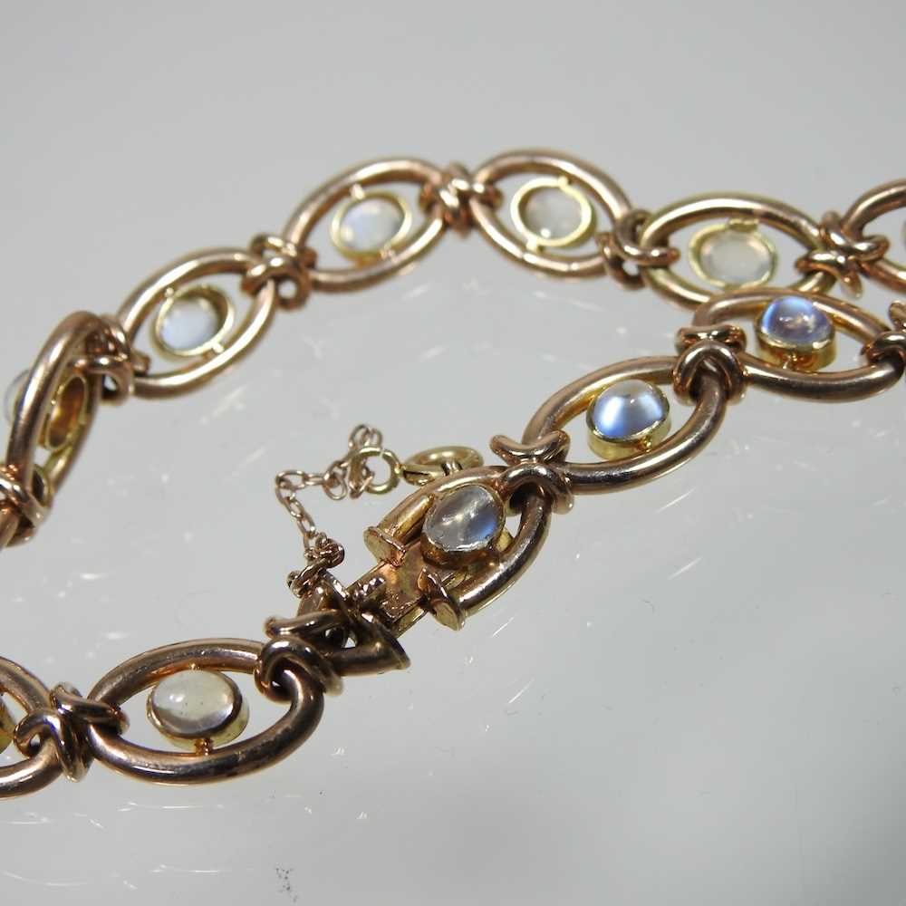 A 15 carat gold and moonstone fancy link bracelet, set with a single row of cabochon stones, - Image 2 of 5