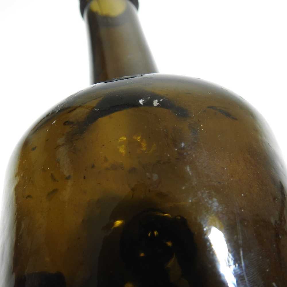 An 18th century English brown glass sealed wine bottle, inscribed All Souls Coll:C:R, 26cm high - Image 5 of 15