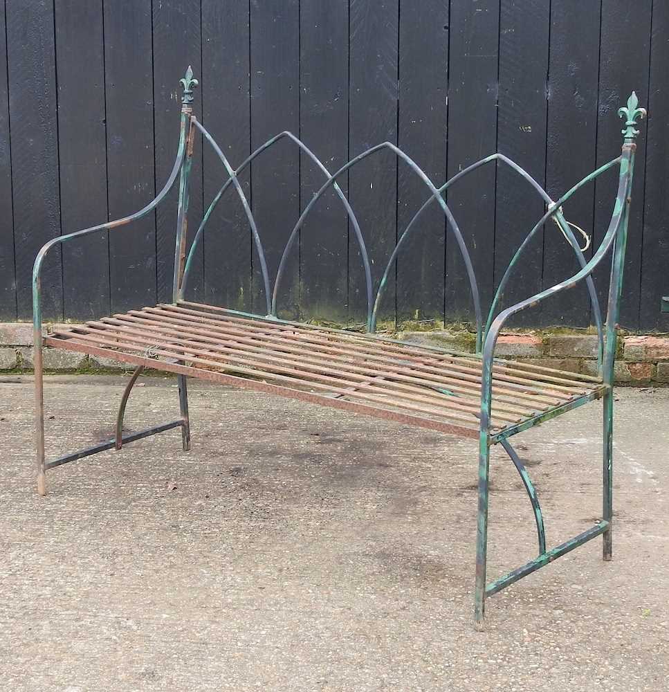 A Regency style iron garden bench, of gothic design 135w x 51d x 105h cm