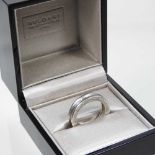 A Bulgari 18 carat white gold ring, of plain ribbed design, inscribed to one side, 5.8g, size P,