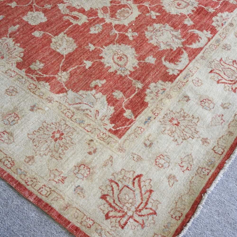 A kashan carpet, with floral designs, on a red ground, 240 x 172cm - Image 3 of 4