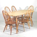 A 1970's Ercol light elm dining table, together with a set of five dining chairs (6) 151w x 77d x