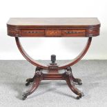 An unusual 19th century mahogany folding tea table, with a hinged rectangular top, on a carved U