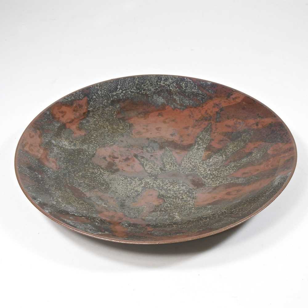 An early 20th century WMF Ikora enamelled bronze dish, impressed marks to base, 25cm diameter