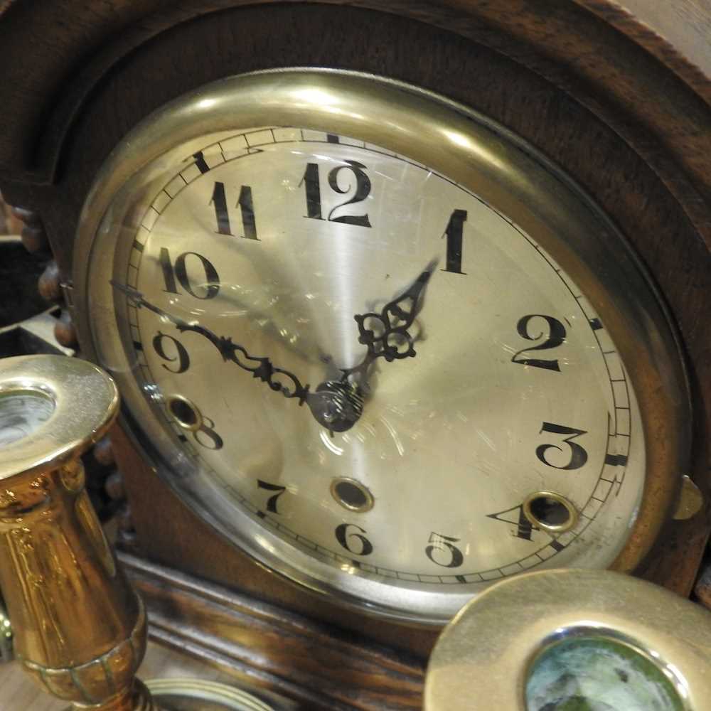 An early 20th century oak tantalus, 24cm wide, together with a 1920's oak cased mantel clock, - Image 2 of 3