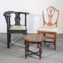 A 19th century carved oak corner chair, together with an oak shield back chair and an occasional
