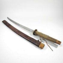 An early 20th century Japanese sword, with a curved steel blade and leather scabbard, with