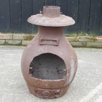 A metal chiminea, 74cm high No stand or doors