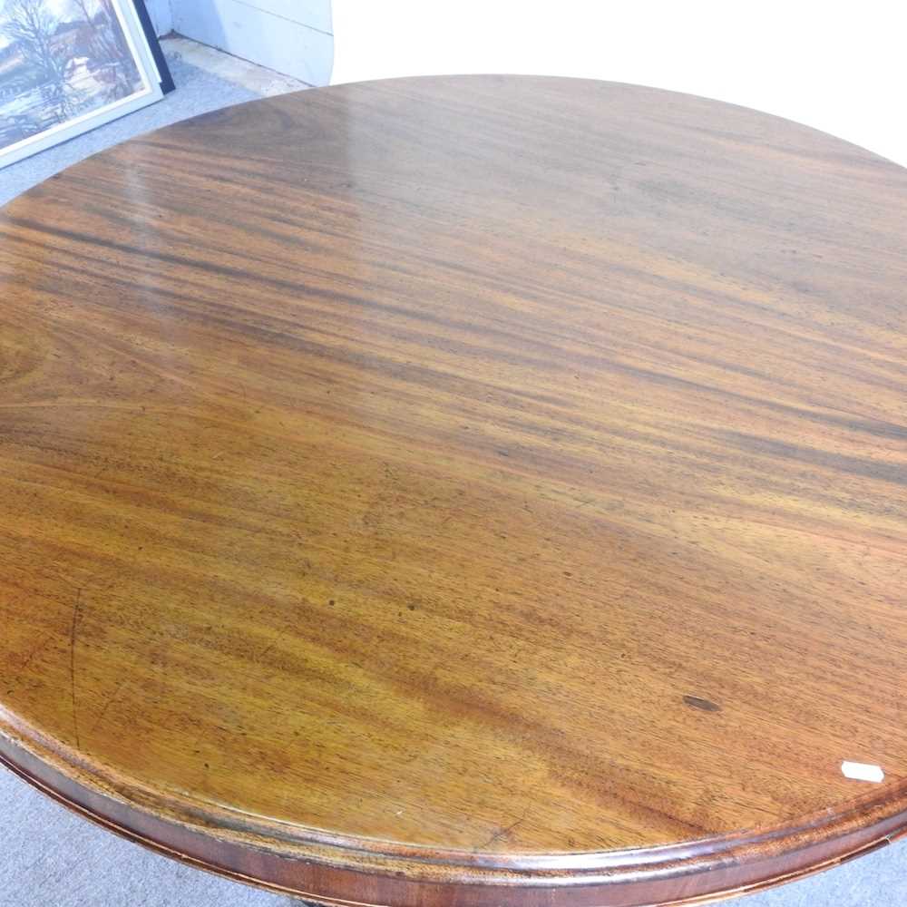 A Victorian hardwood breakfast table, with a hinged circular top, on a platform base 115w x 81h cm - Image 3 of 6