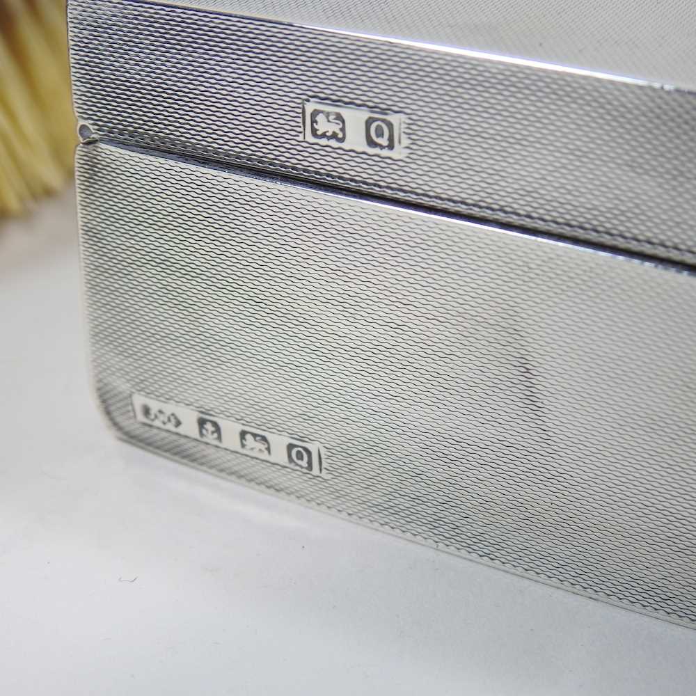 A silver table cigarette case, with engine turned decoration, Birmingham 1940, 14cm wide, together - Image 3 of 6