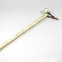 A Chinese carved bone sectional walking stick, with a horn handle, 85cm long