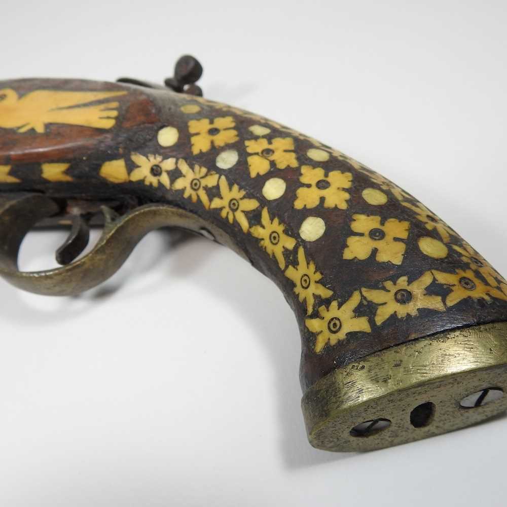 A middle Eastern flintlock pistol, with bone inlay, 40cm long Overall condition is complete. It is - Image 6 of 8