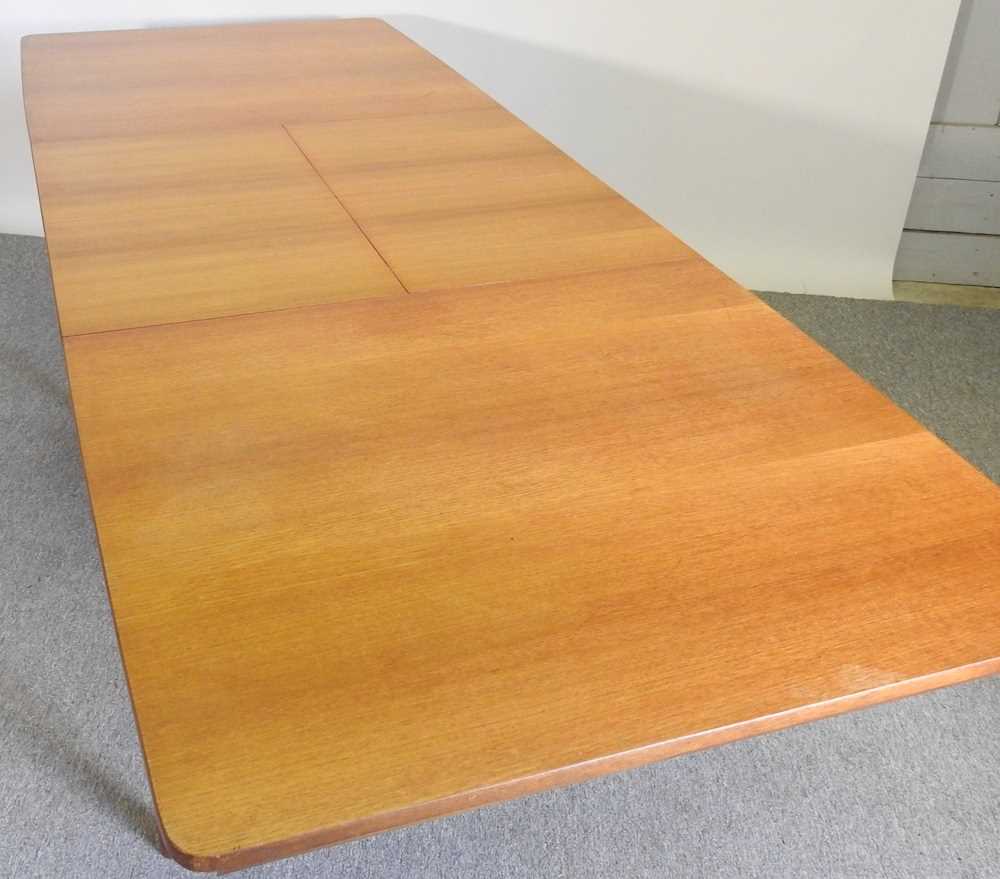 A 1970's teak extending dining table, with two additional leaves, bearing a label for A H McIntosh & - Image 5 of 5