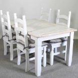 A modern white painted dining table, together with a set of four painted ladderback dining chairs (