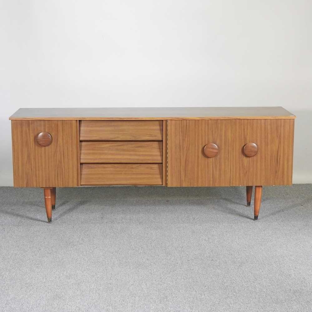 A 1970's laminated sideboard, on tapered legs 182w x 45d x 72h cm