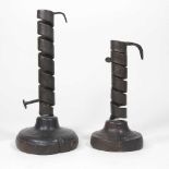 An 18th century French iron Rat de Caves spirally turned candlestick, on a wooden base, 21cm high,