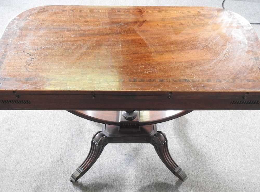 An unusual 19th century mahogany folding tea table, with a hinged rectangular top, on a carved U - Image 4 of 5