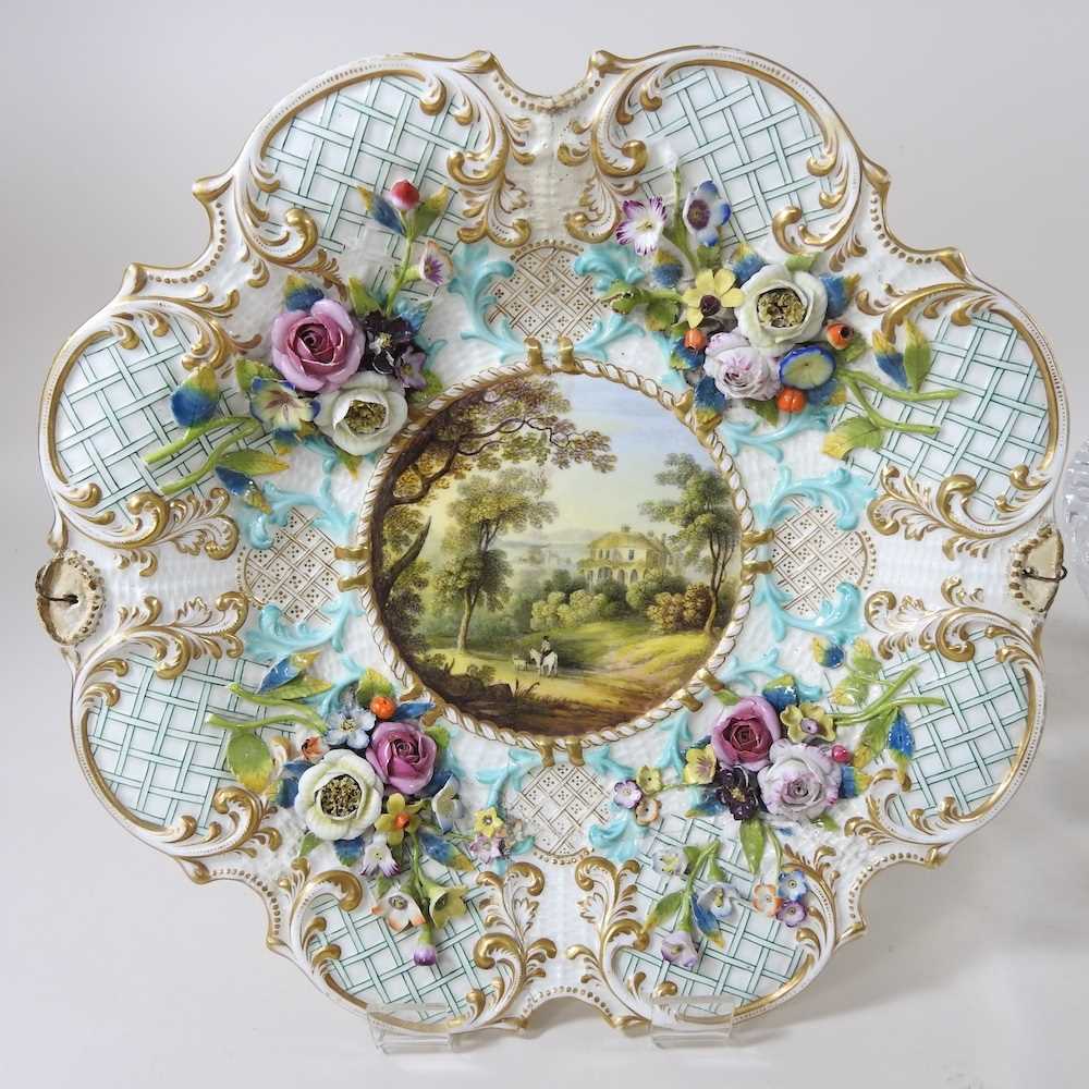 A 19th century Dresden porcelain plate, painted with a landscape, within a floral encrusted - Bild 3 aus 7