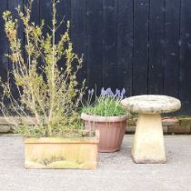 A cast stone bird bath, together with a terracotta trough and a garden pot (3) 50w x 54h cm