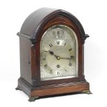 An early 20th century bracket clock, by Maple & Co., with an inlaid lancet shaped case and signed
