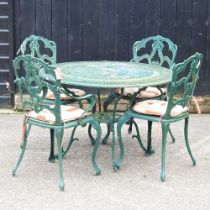 A green painted garden table, together with four matching chairs, with cushions