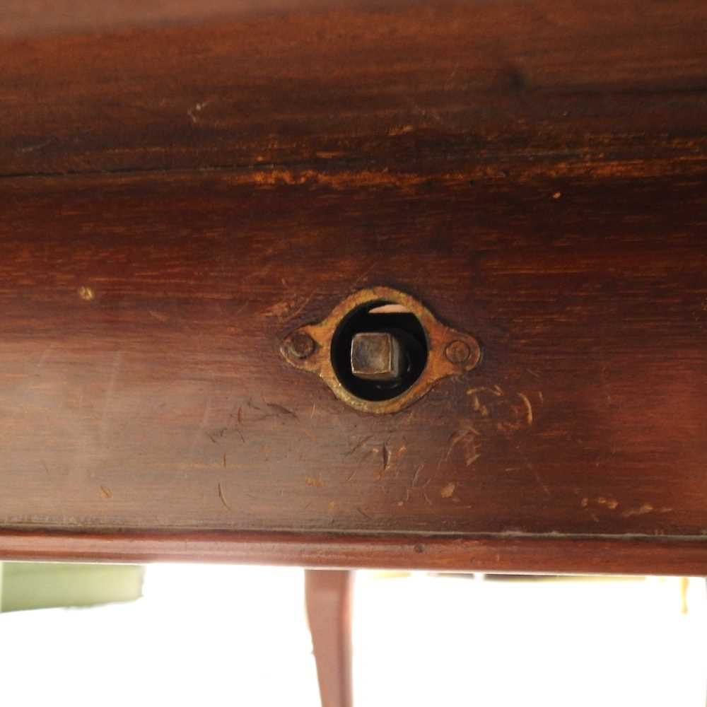 An early 20th century wind out extending dining table, of oval shape, on a claw and ball feet, - Image 7 of 8