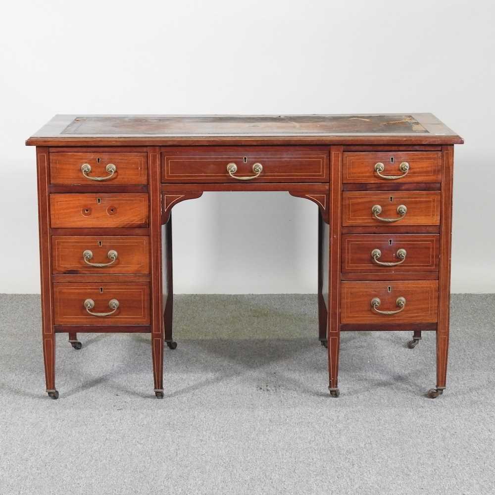 An Edwardian inlaid mahogany pedestal desk, with an inset writing surface 114w x 59d x 73h cm