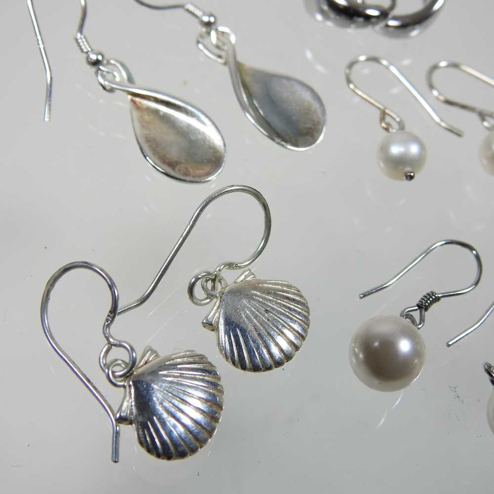 A pair of silver shell shaped pendant earrings, 2cm high, together with a collection of six pairs of - Image 2 of 3