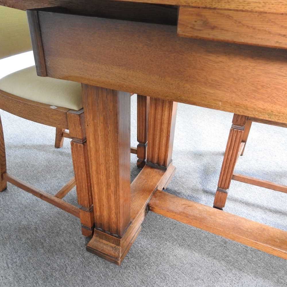 A 1930's light oak draw leaf dining table, together with a set of four matching dining chairs (5) - Image 4 of 8